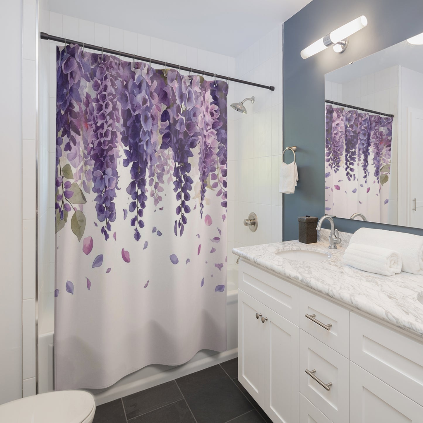 Bathroom with a purple floral shower curtain and white vanity.