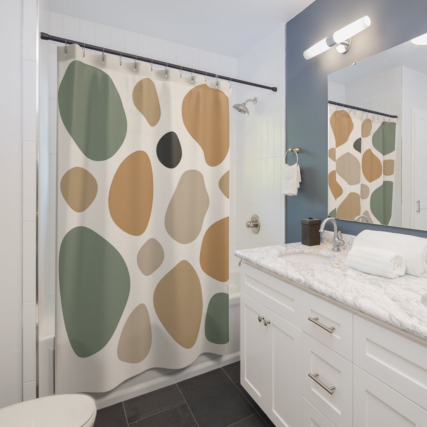 Bathroom with a shower curtain featuring large, colorful abstract patterns.