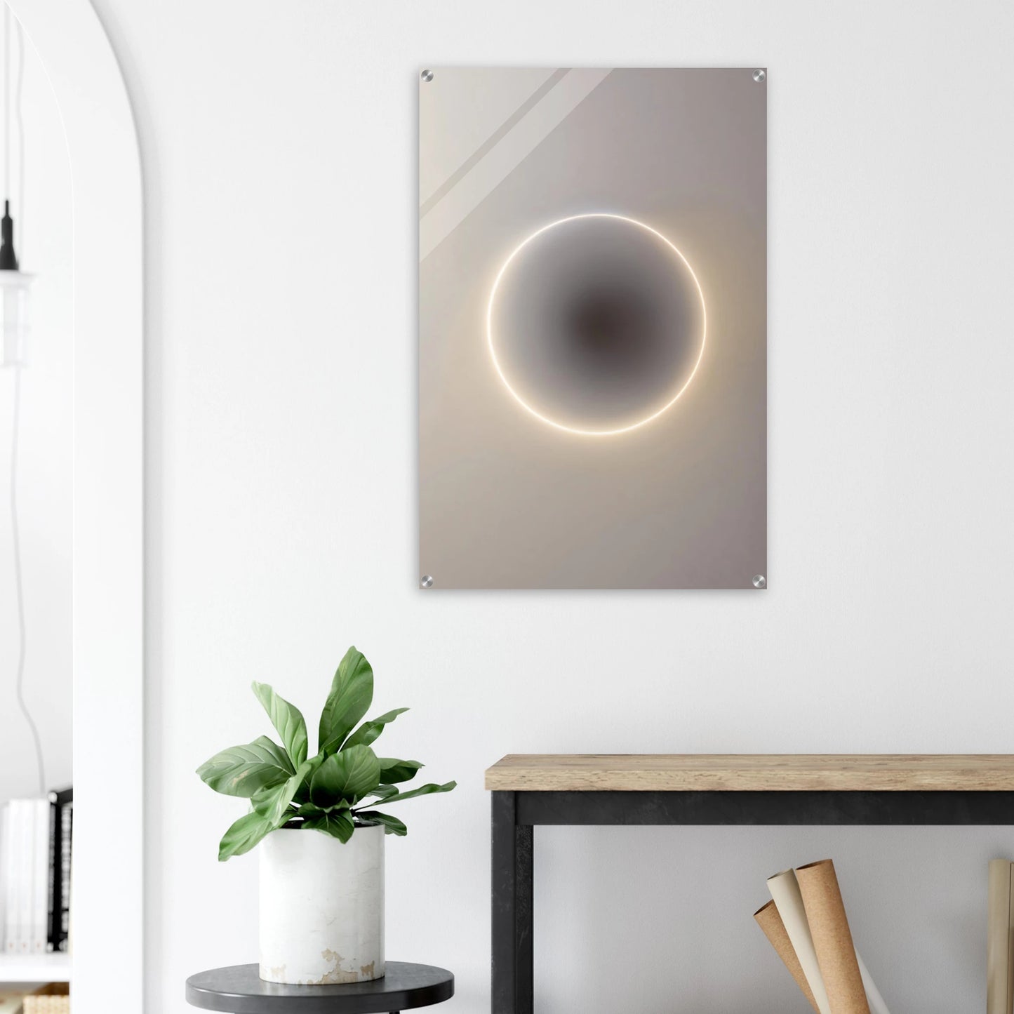 Modern wall art piece with circular design and glowing edge in a minimalistic room.