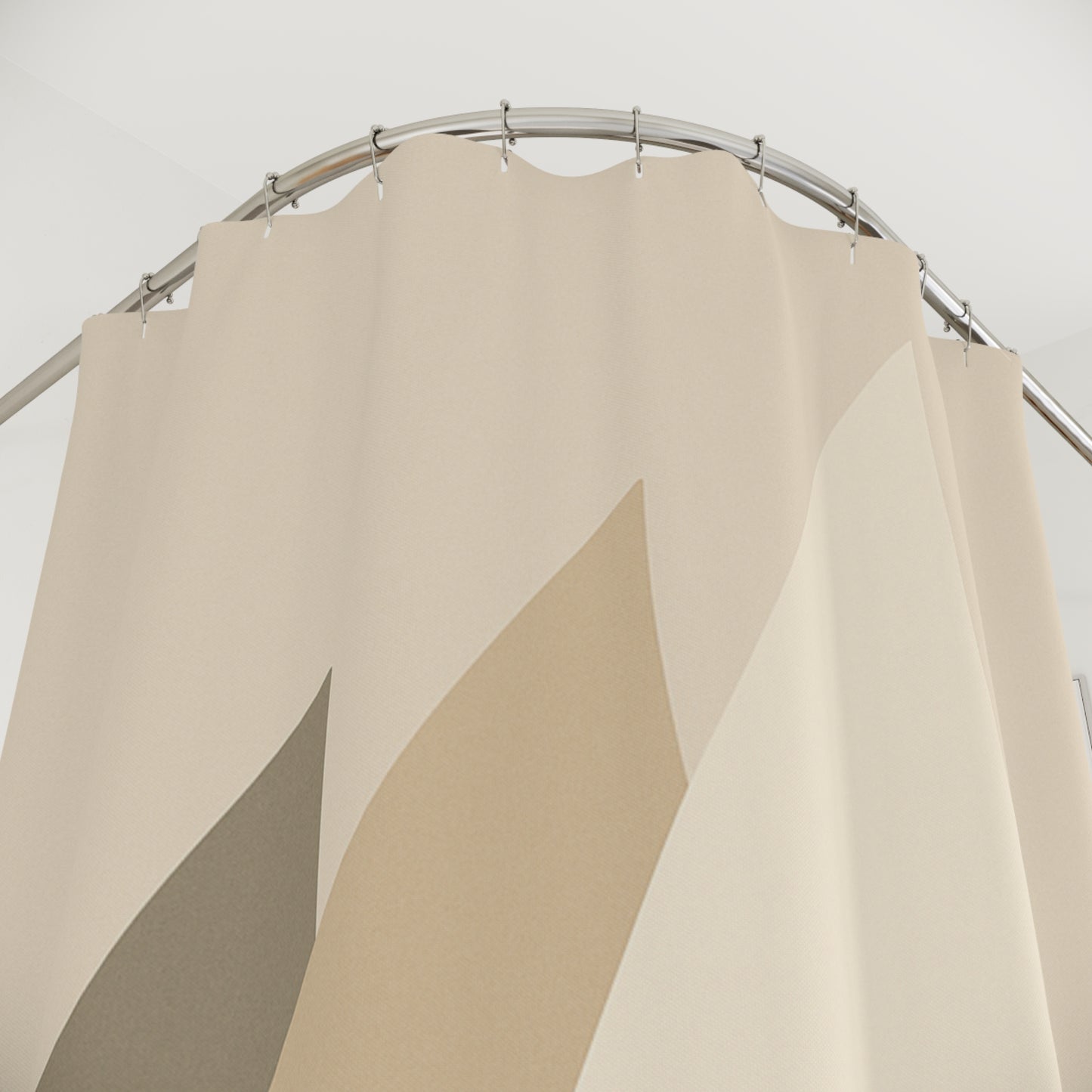 Beige fabric swatches on a metal rod against a white background