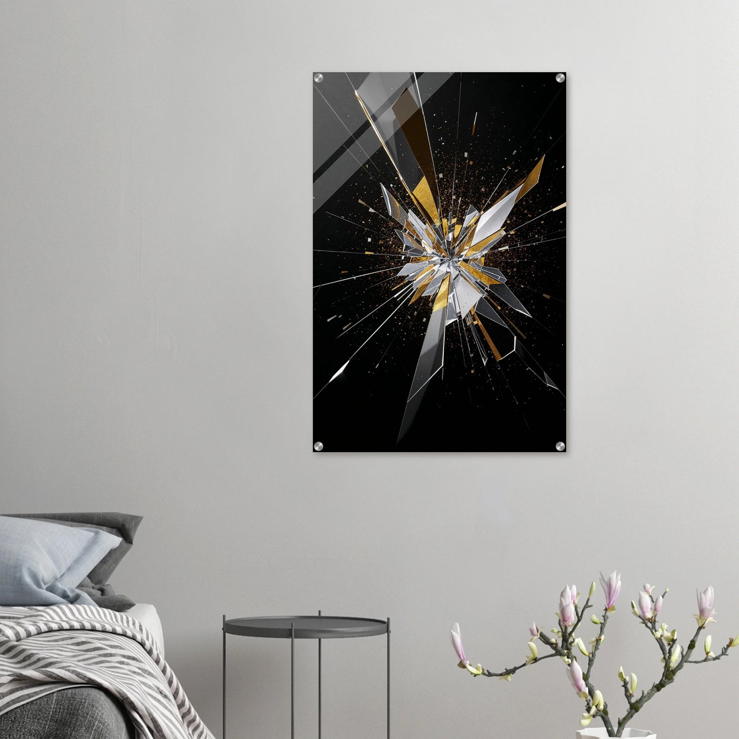 Abstract art print of a shattered glass effect on a gray wall above a bed.