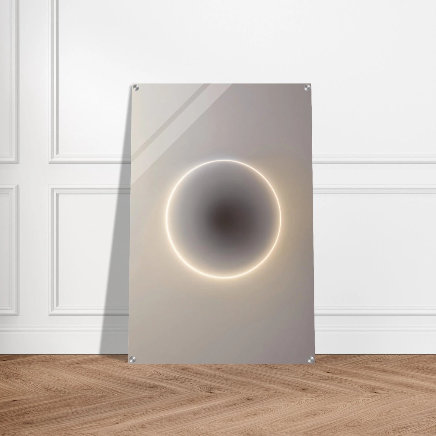 Modern wall art piece with circular design and light effect on a white wall.