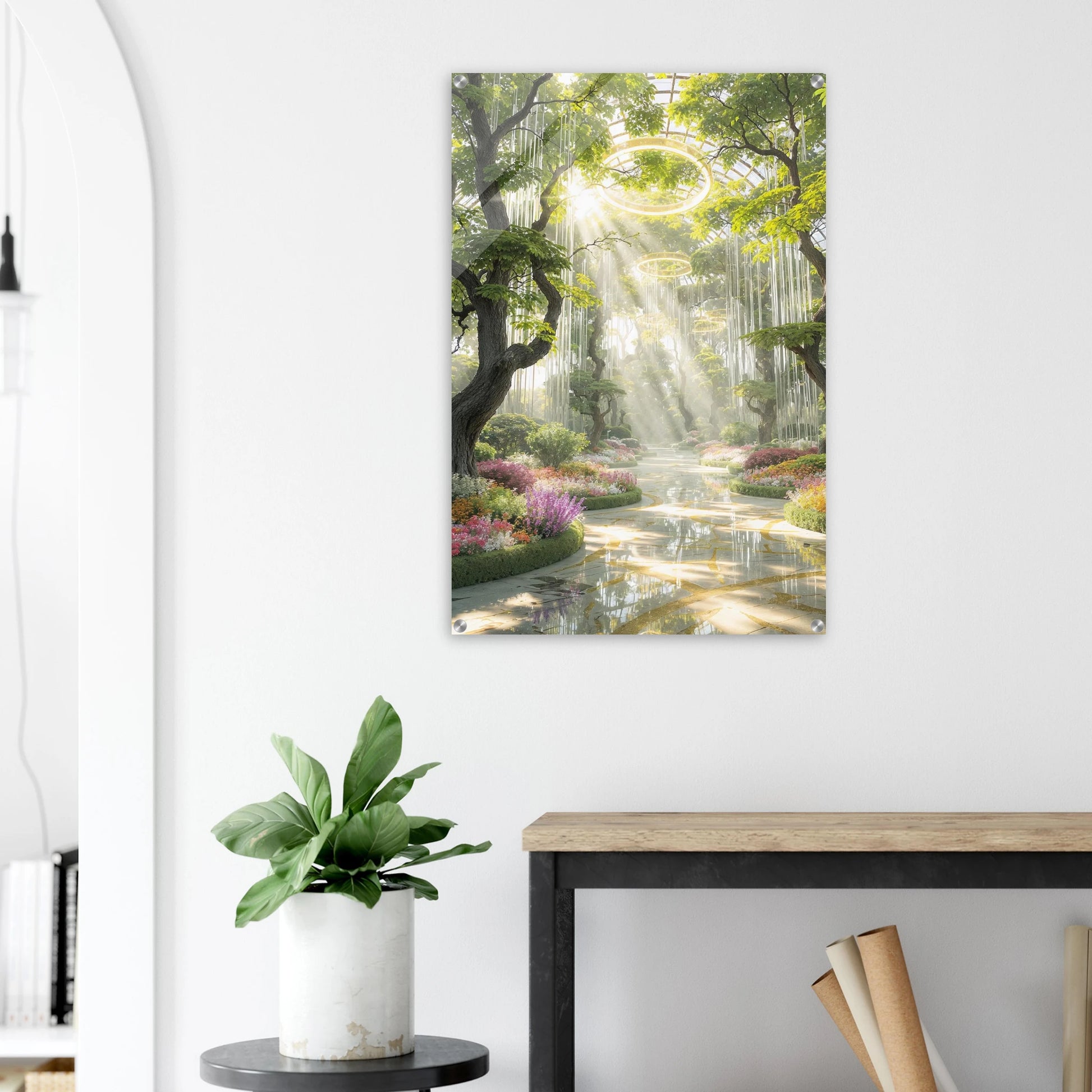 Canvas print of a nature scene with a forest and stream, hanging on a white wall above a desk.