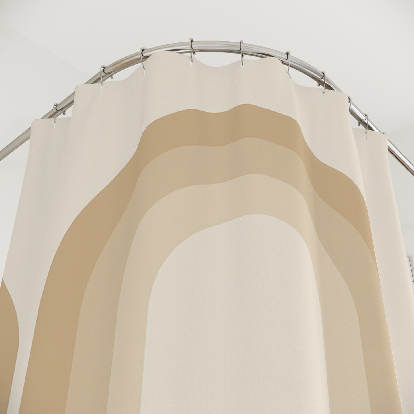 Set of beige curtains on a metal rod against a white background