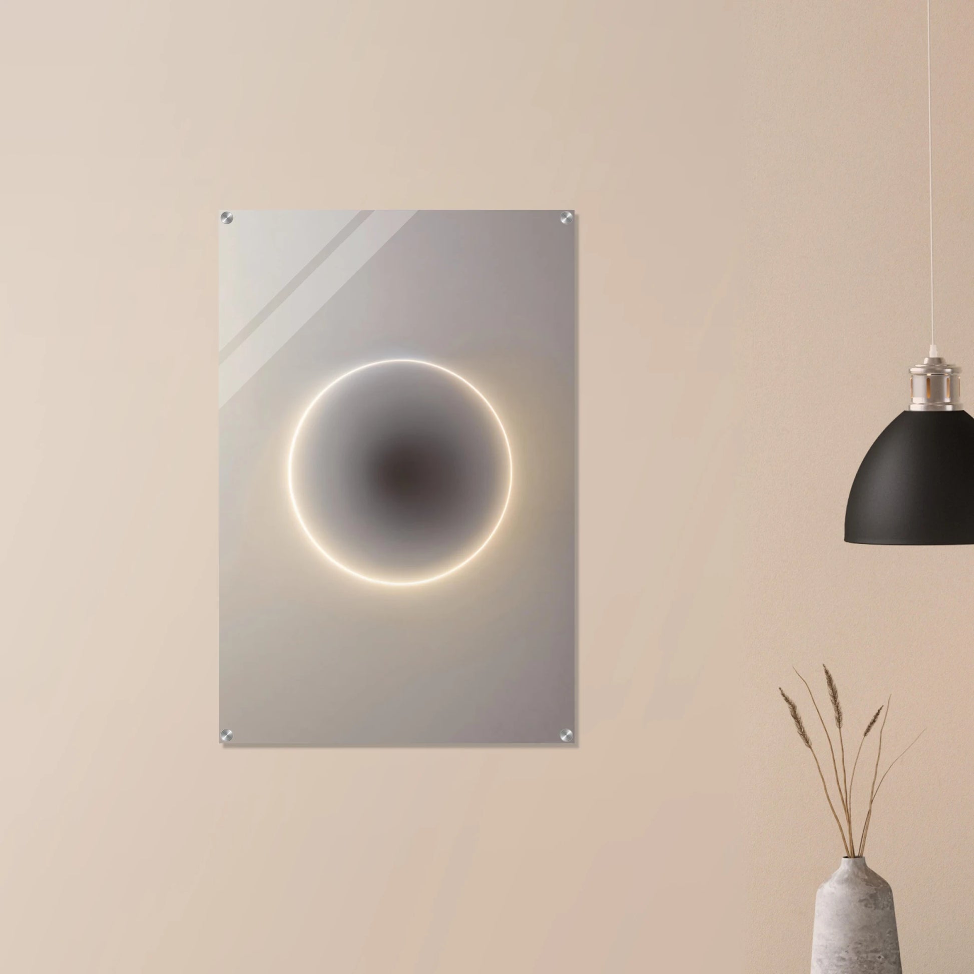 Decorative wall mirror with a circular light feature on a beige wall, next to a black pendant light and a vase with dried plants.