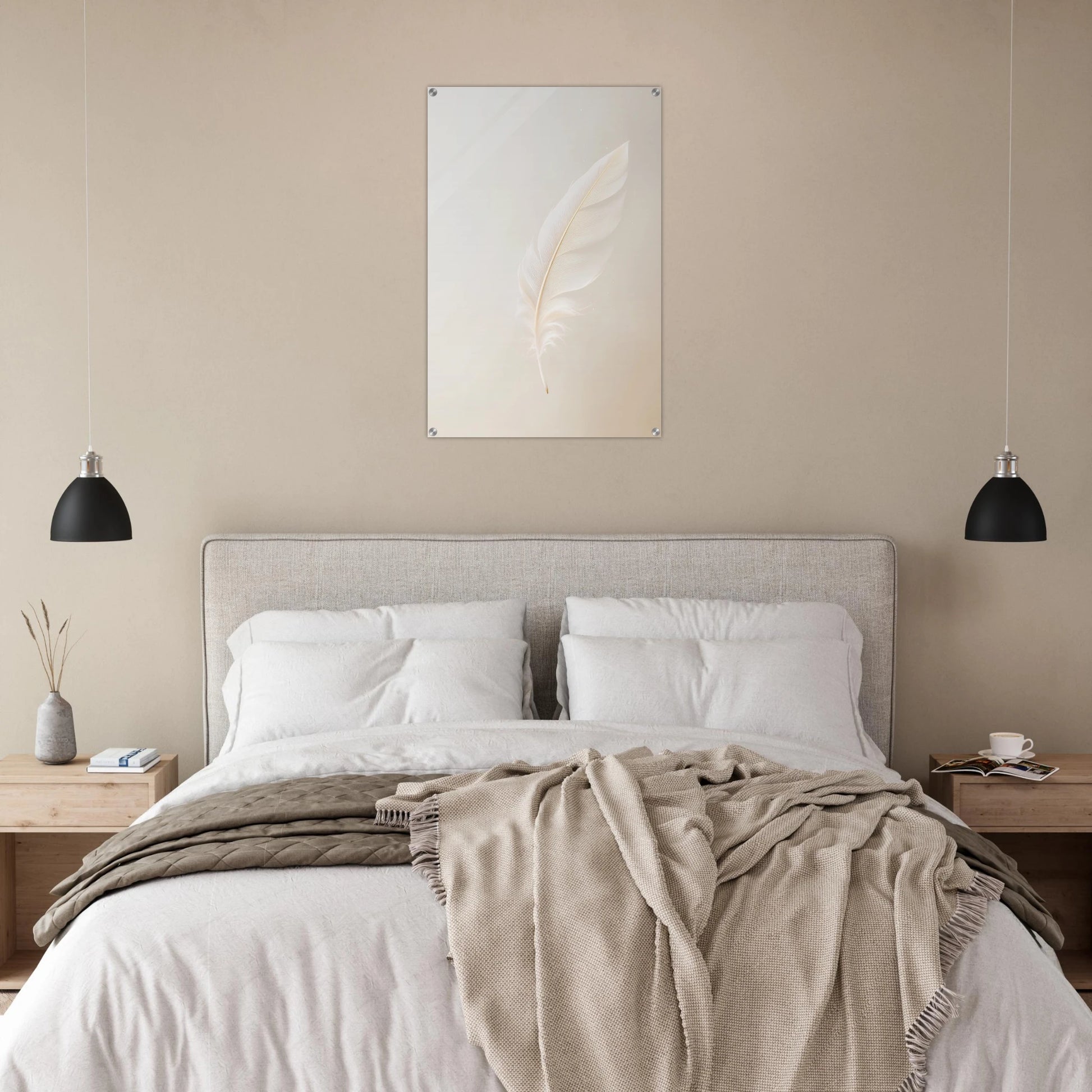Neatly made bed with beige blanket and pillows in a bedroom setting.