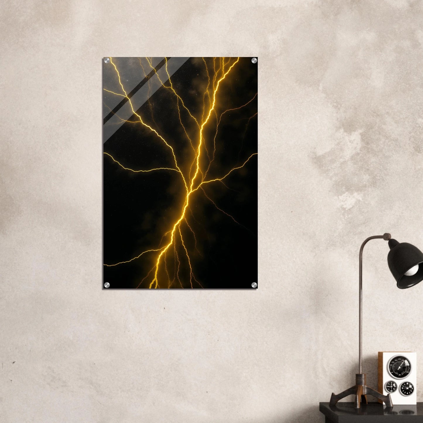 Abstract art print of yellow lightning on a black background, mounted on a textured wall.