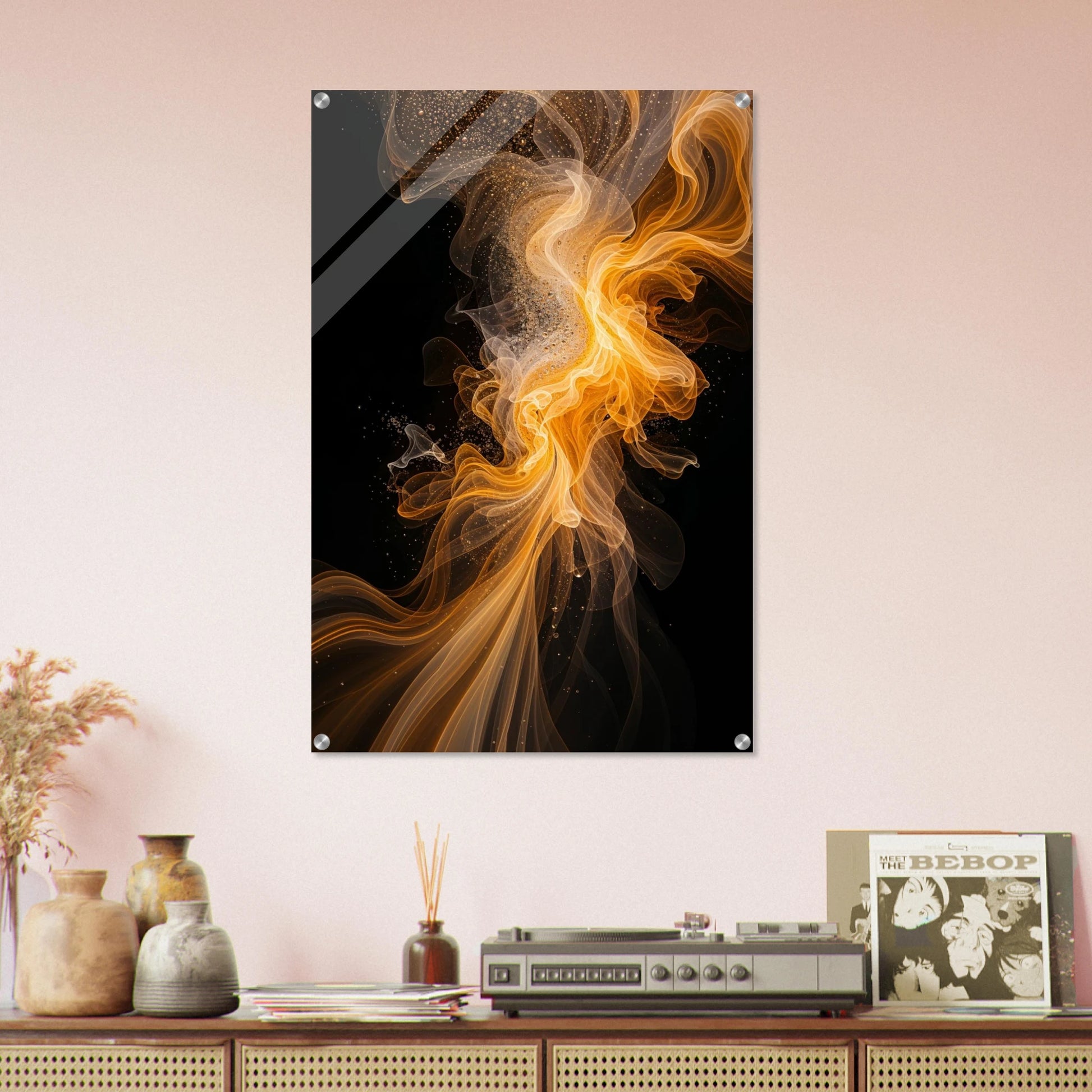 Abstract art piece on a wall above a wooden shelf with decorative items.