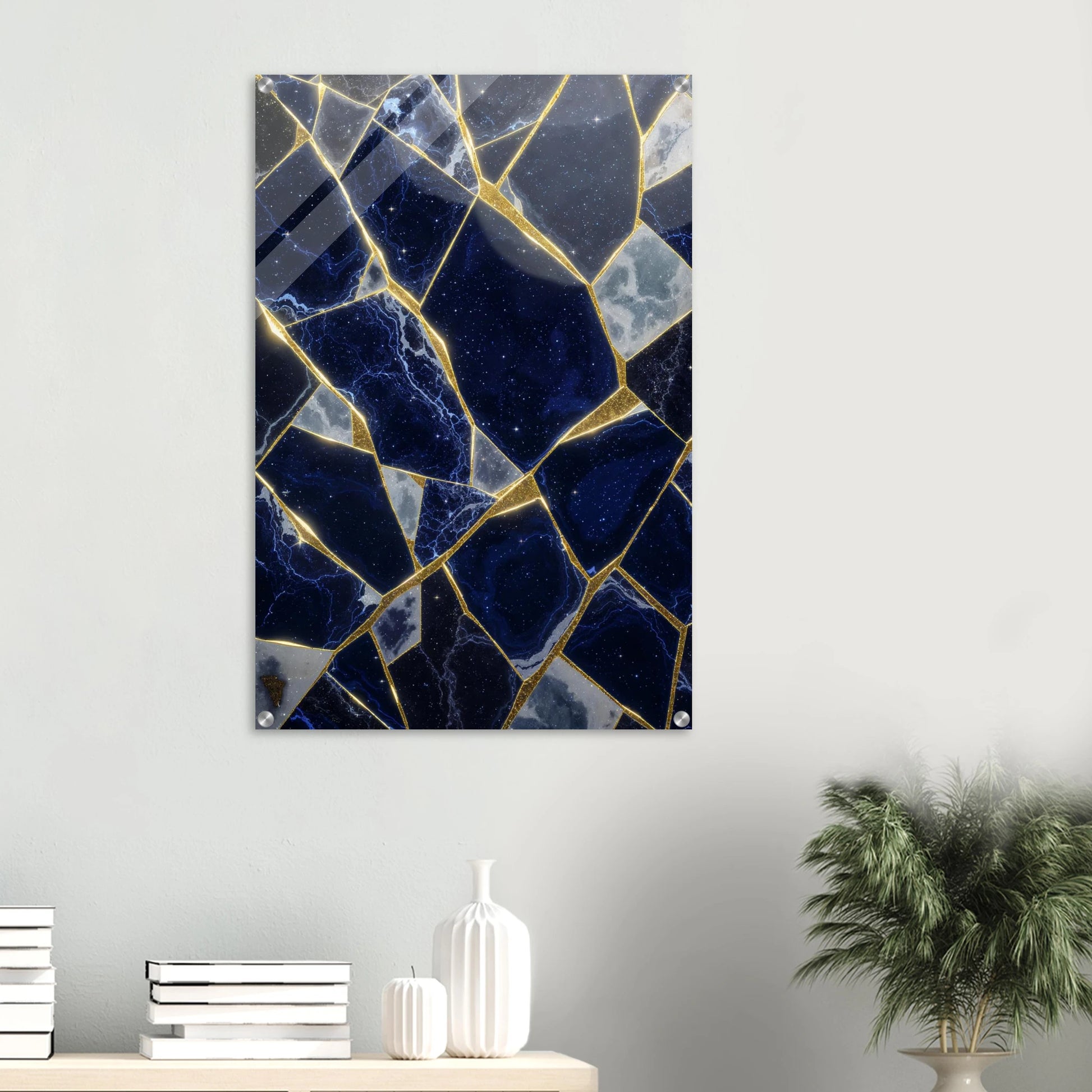 Marble-patterned wall art on a white wall with decorative items below.