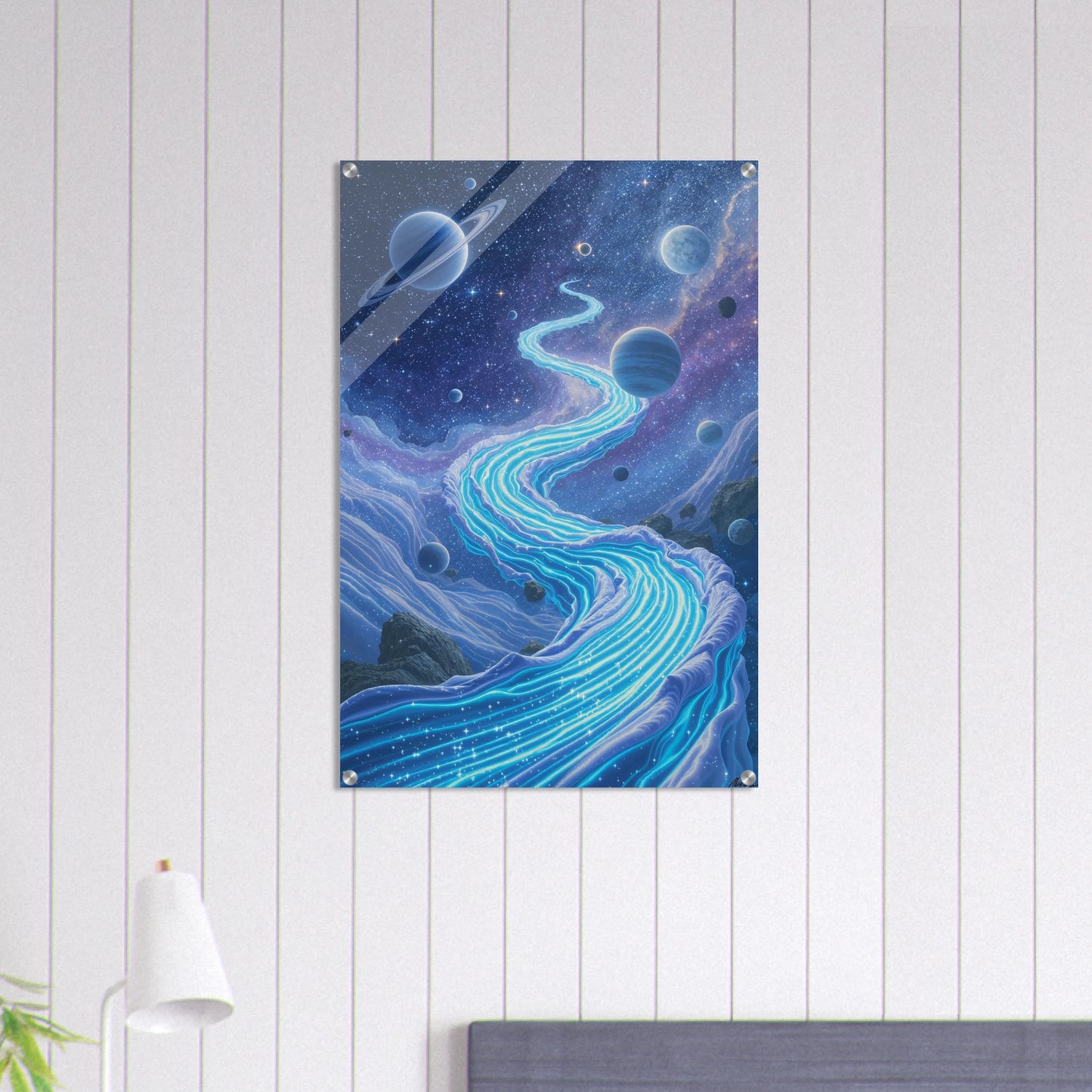 Space-themed wall art with planets and a starry sky on a white wooden panel wall.