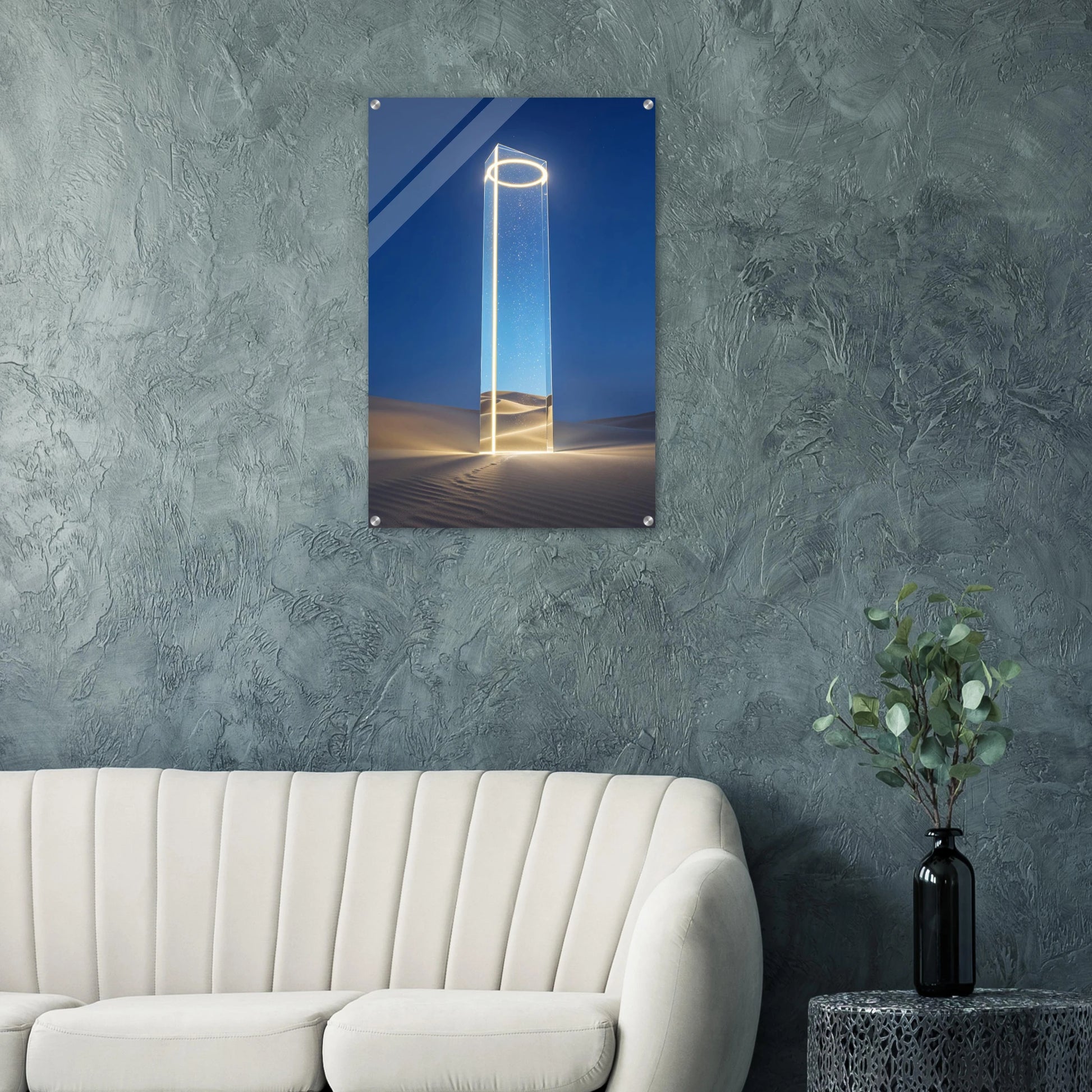 Futuristic sculpture on a wall above a sofa with a plant on a side table.