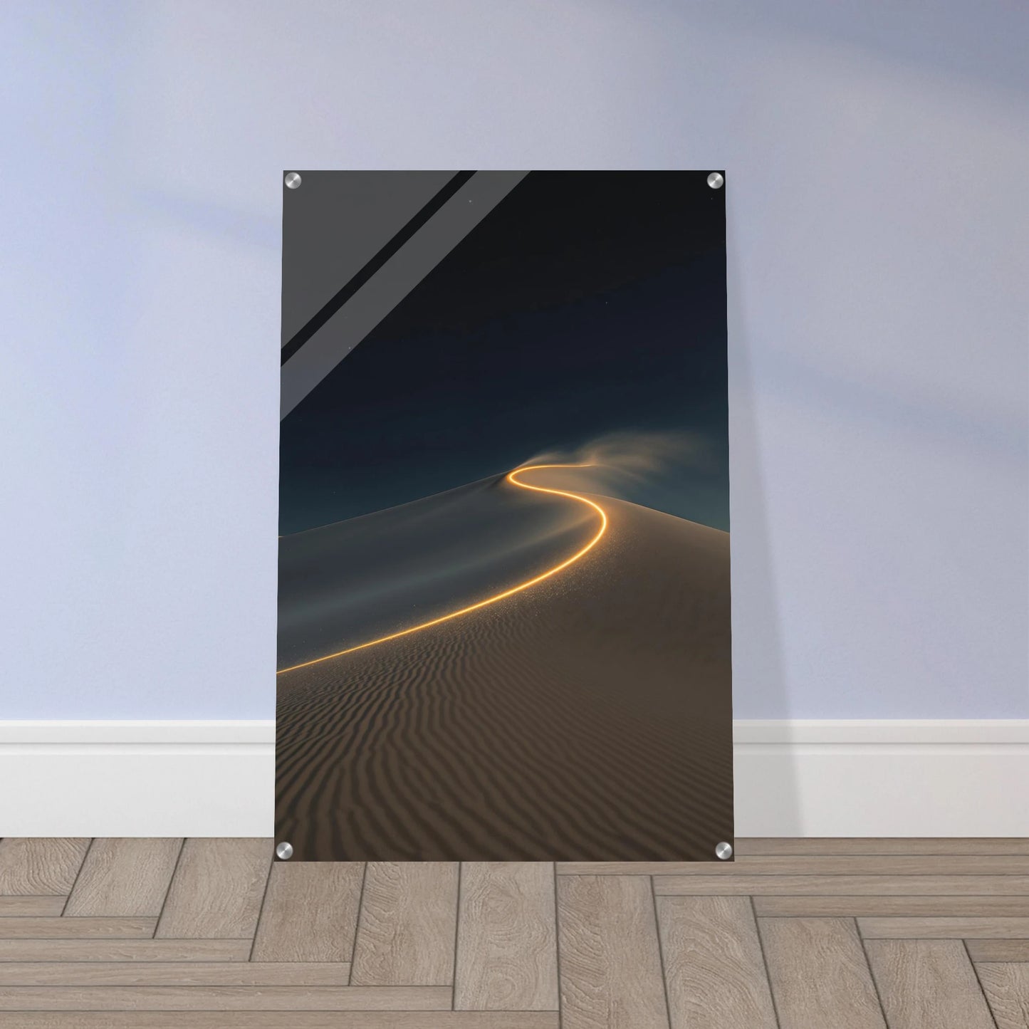 Framed artwork of a desert landscape with a glowing path on a wall.