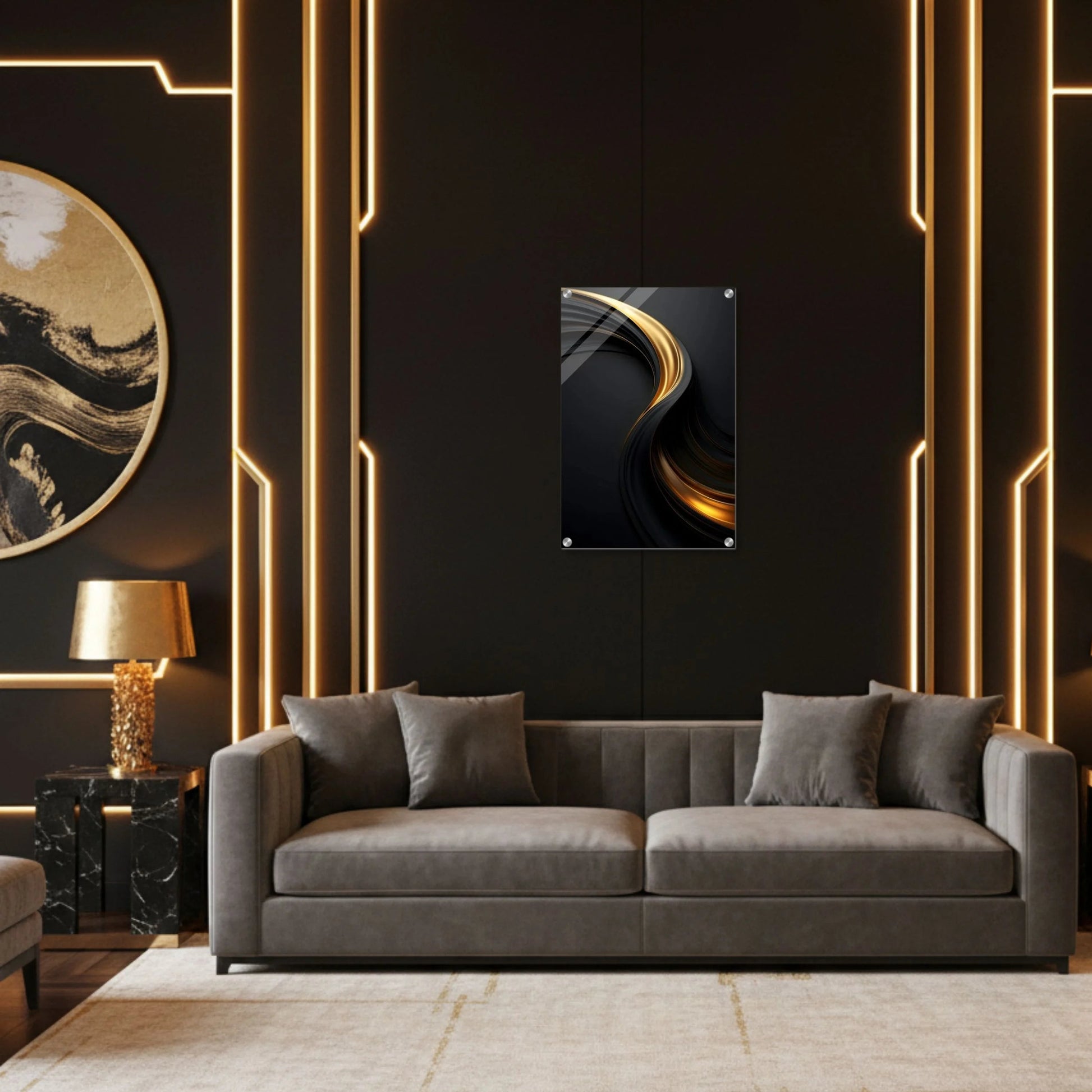 Modern living room with a gray sofa, decorative wall art, and gold accents.