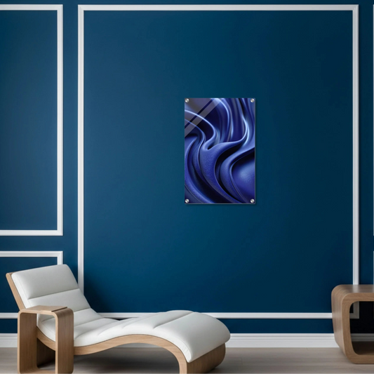 Abstract blue artwork on a blue wall with a modern chair and table.