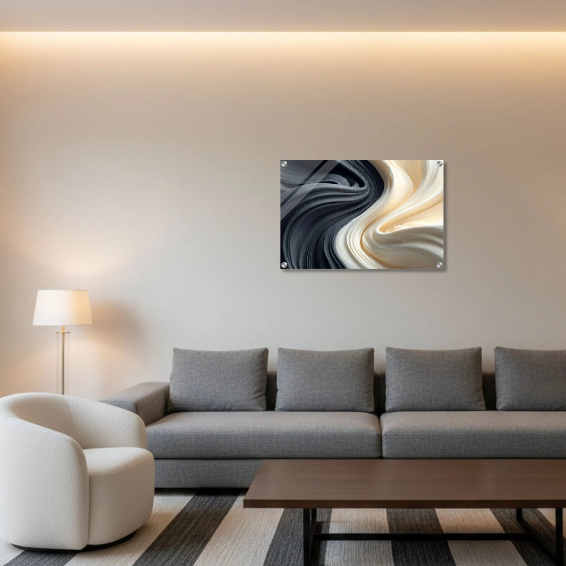 Modern living room with a gray sofa, coffee table, and abstract wall art.