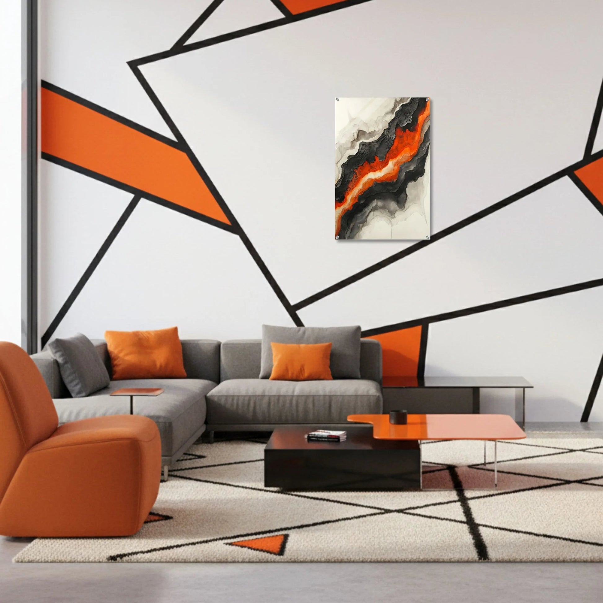 Modern living room with orange and gray furniture, abstract wall art, and geometric wall design.