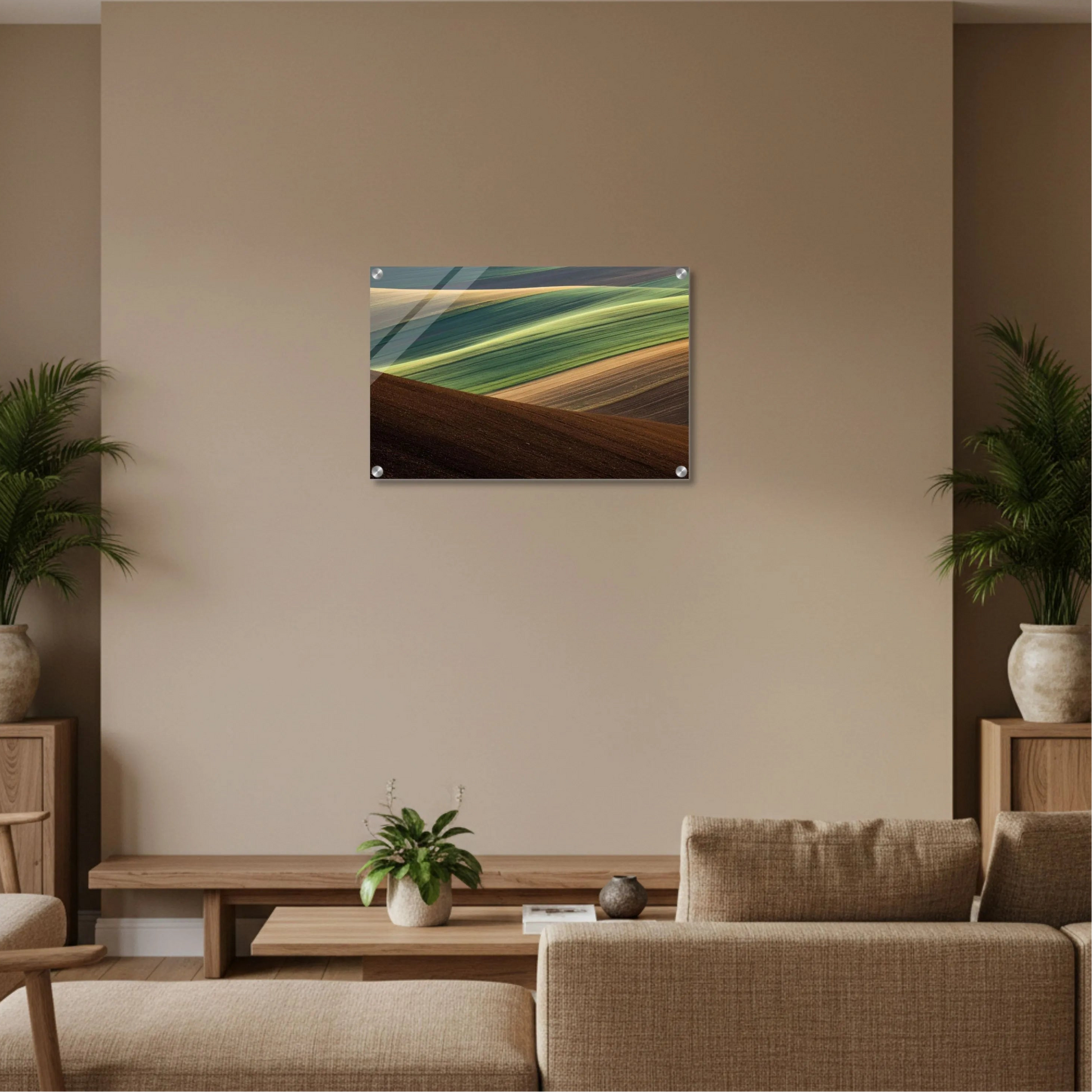 Surreal landscape painting on a beige wall above a sofa in a living room.