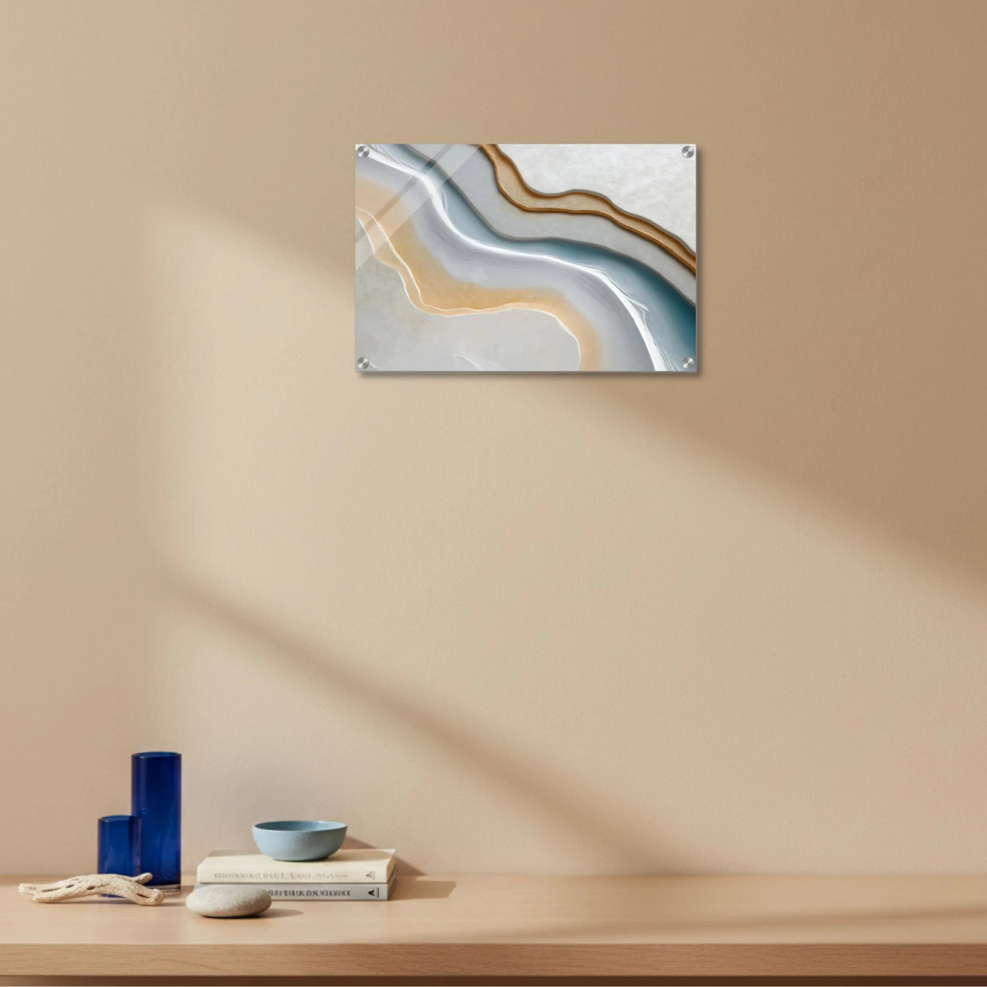 Abstract wall art on a beige wall with a wooden shelf below