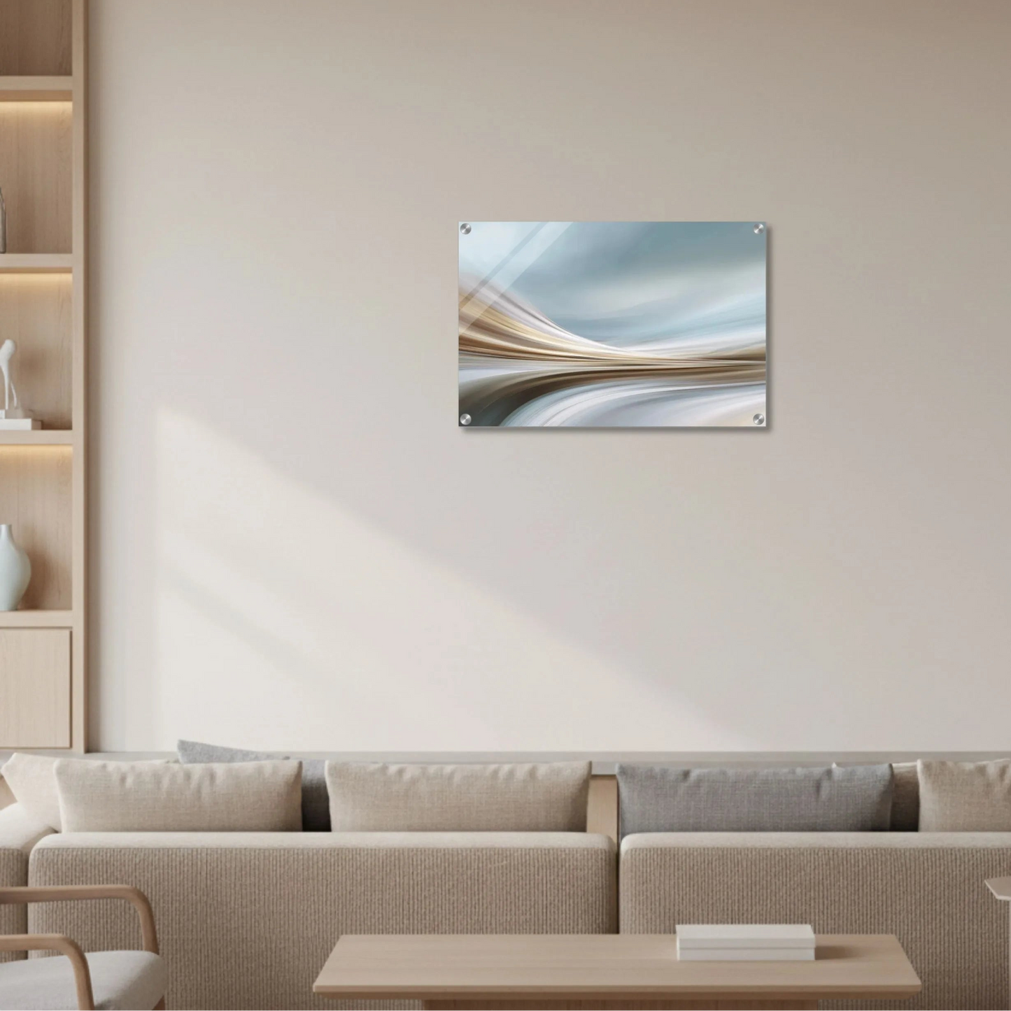 Abstract wall art on a beige wall above a sofa in a living room.