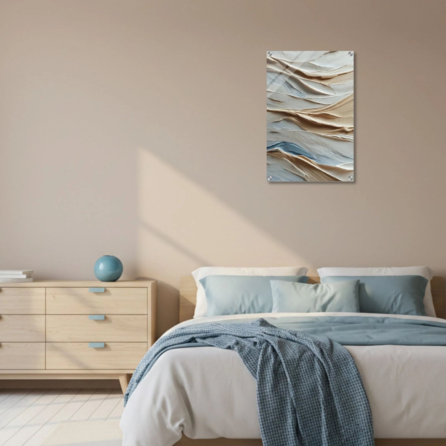 Modern bedroom with a bed, dresser, and abstract wall art.
