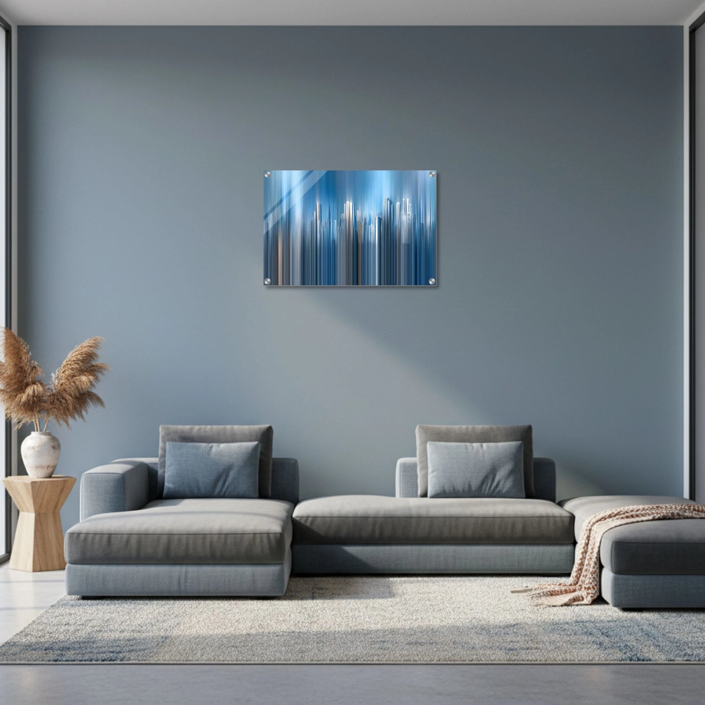 Modern living room with a gray sofa, abstract wall art, and decorative elements.