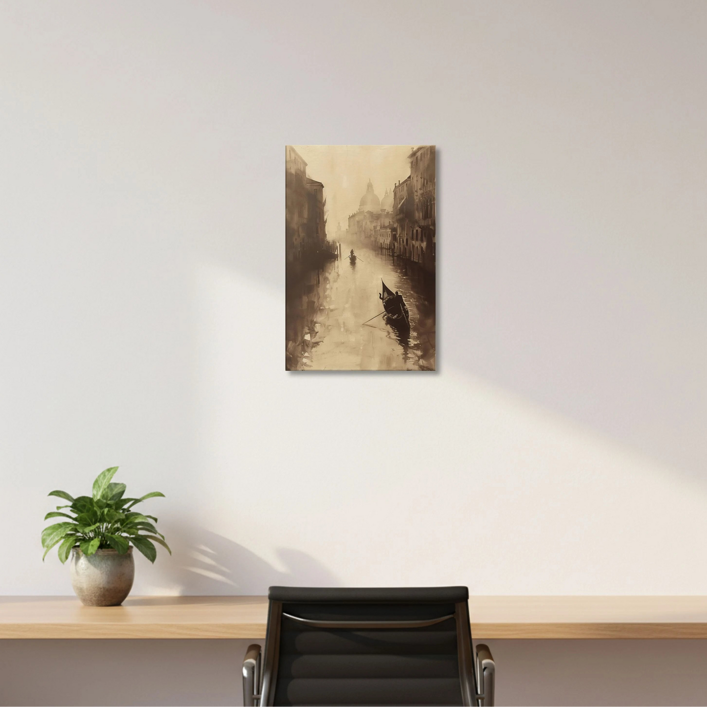 Canvas print of a cityscape with a boat on a white wall above a desk with a plant and chair.