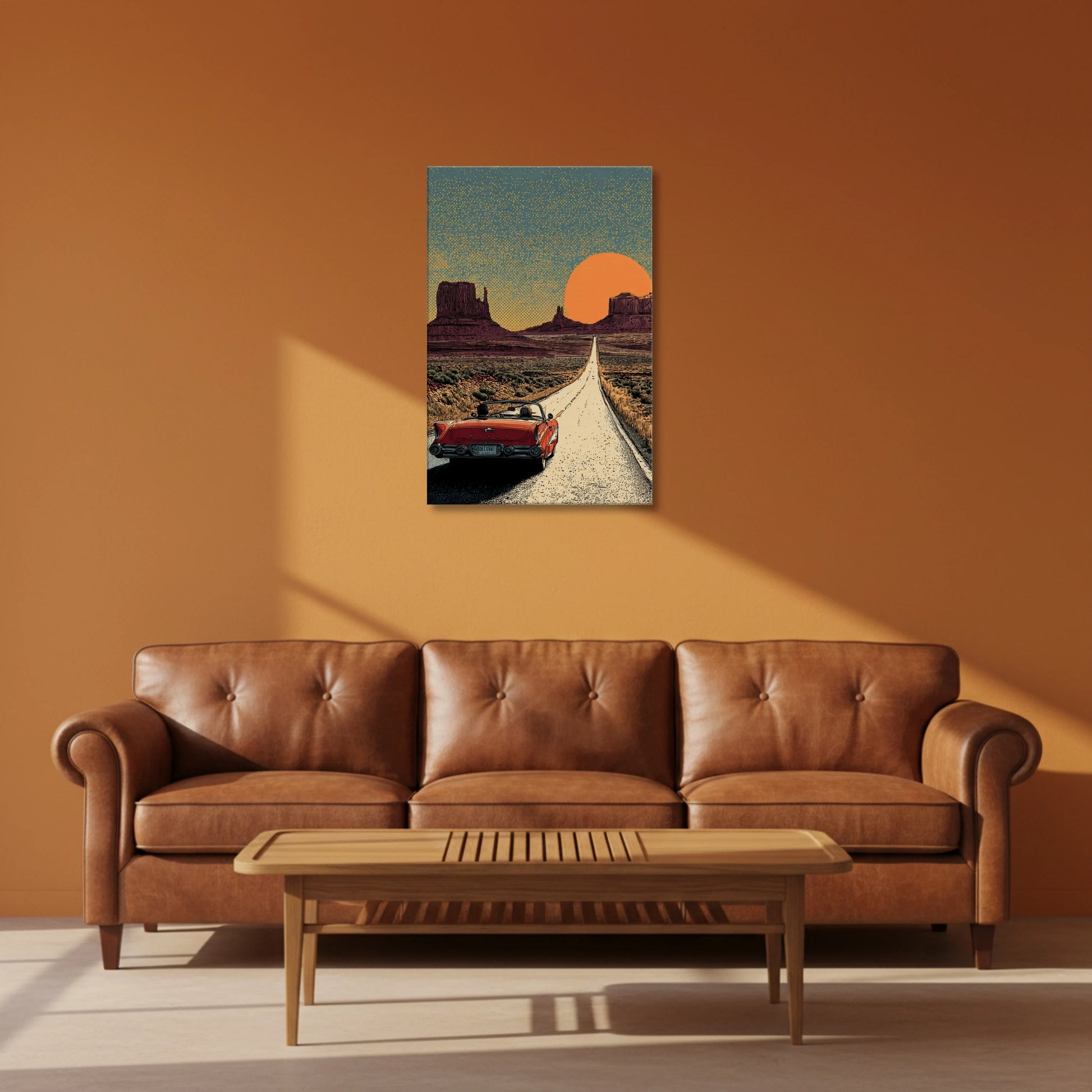 Brown leather sofa in a living room with a painting of a desert scene on the wall.