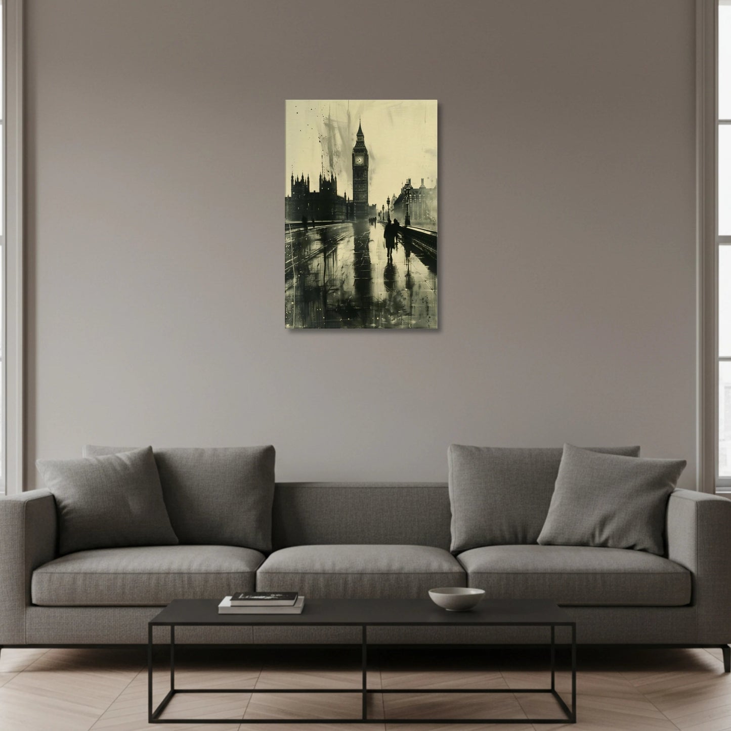 Gray sofa in a living room with a painting of Big Ben on the wall.