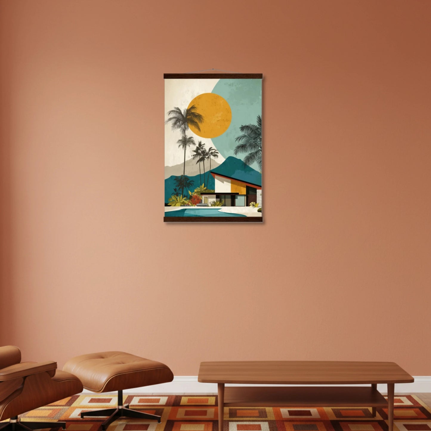 Framed artwork of a tropical scene with palm trees and a house on a peach-colored wall.