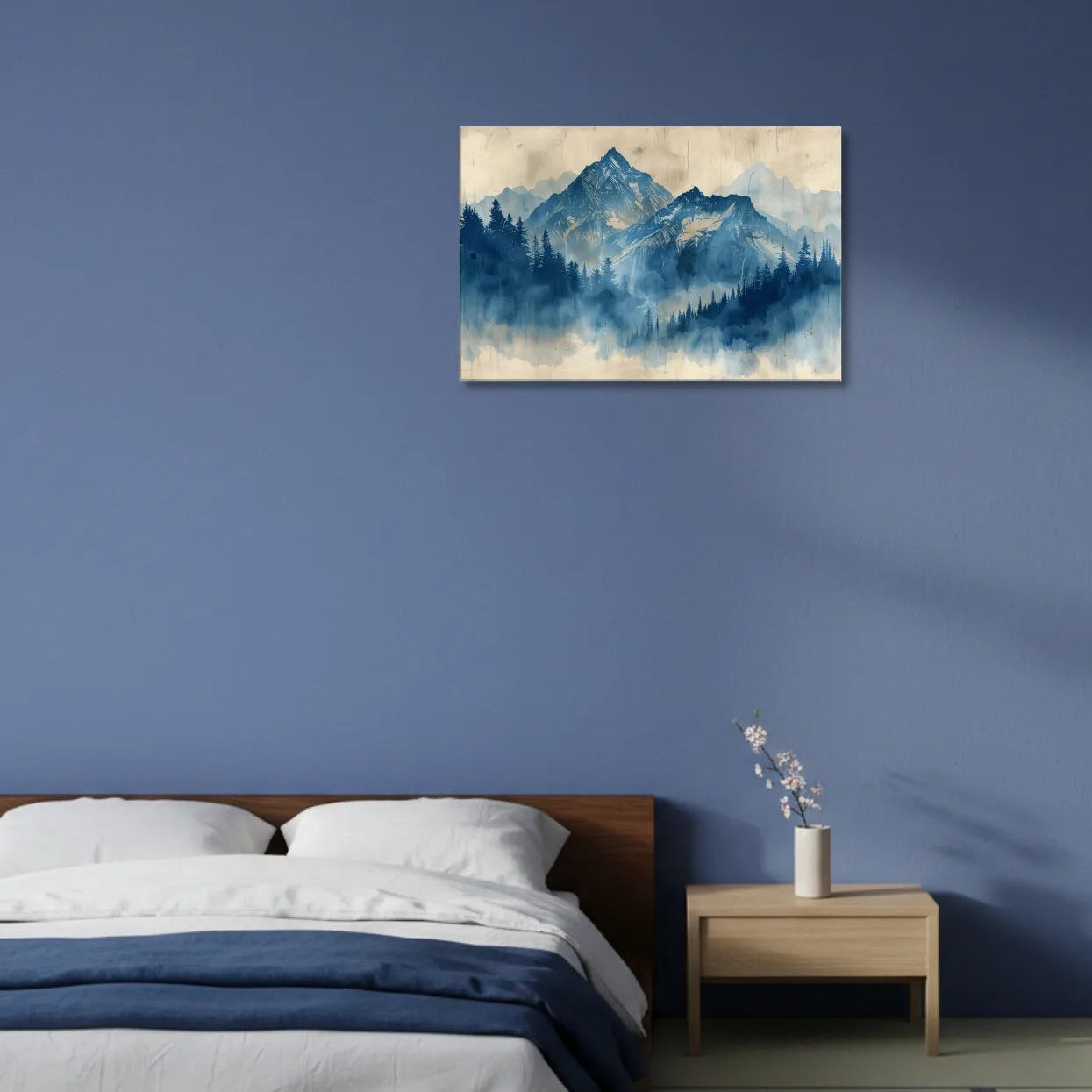 Blue mountain painting on a blue wall above a bed