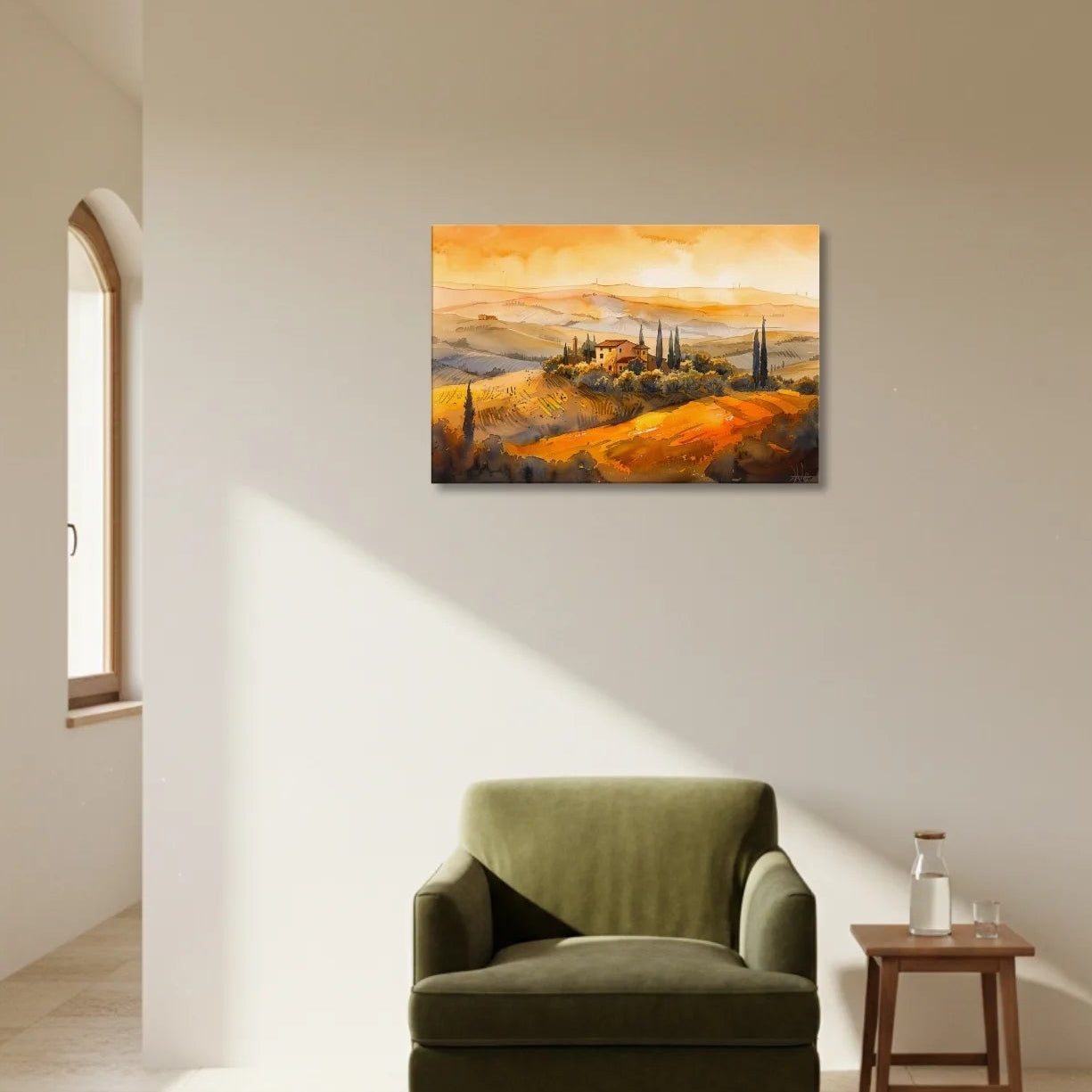 Green armchair in a room with a painting of a landscape on the wall.