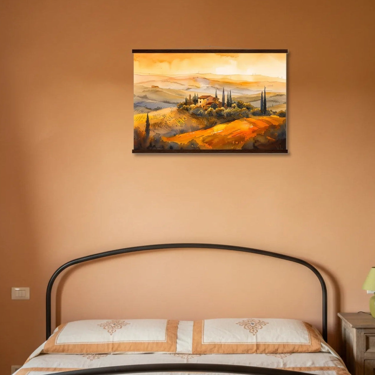 Bedroom with a painting of a sunset over a landscape on the wall above a bed.