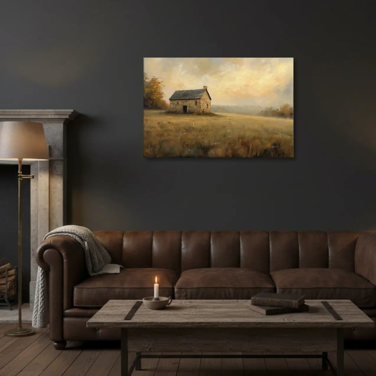 Living room with brown leather sofa, wooden coffee table, and wall art of a cabin in the field.