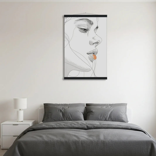 Bedroom with gray bedding and a framed black and white art print on the wall.