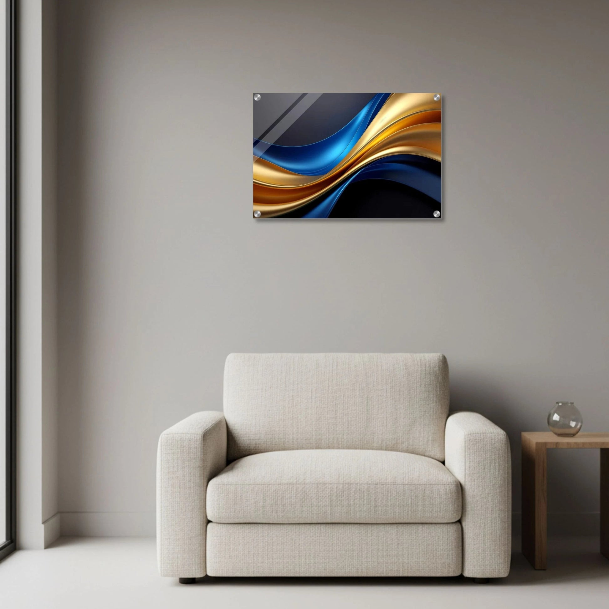 Abstract wall art piece on a gray wall above a beige armchair.