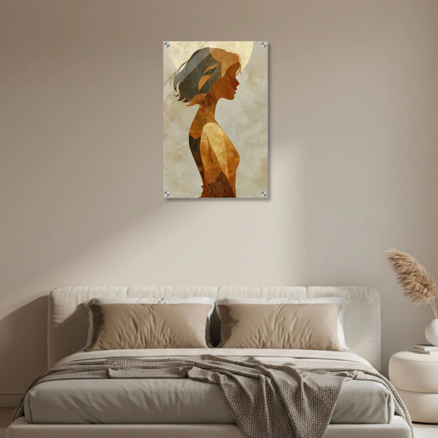 Modern bedroom with a bed and wall art of a woman's profile.